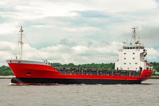 Red new cargo ship moving abroad. Product export in Europe