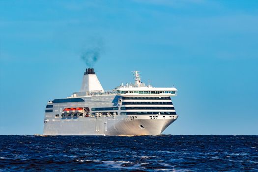 White cruise liner sailing on a clear day