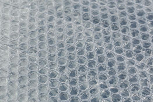air bubble wrap - real life close-up background with selective focus and blur.