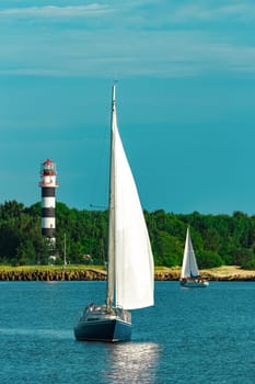 Blue sailboat in the travel by Europe. Sea journey