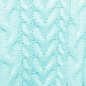 Turquoise knitted textured pattern background.