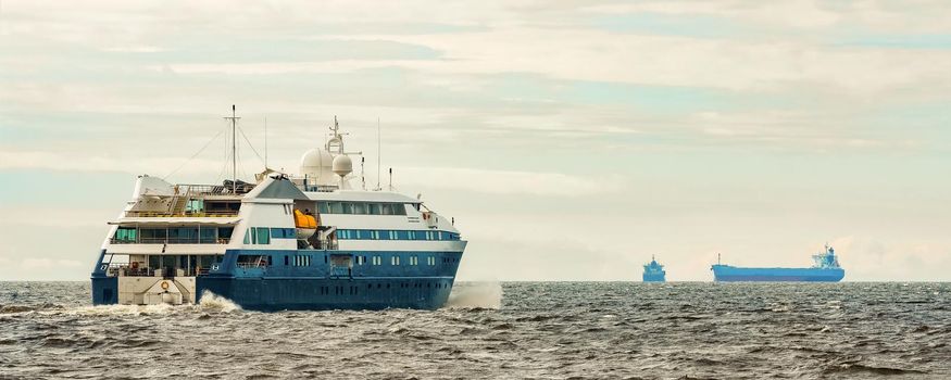 Small blue passenger ship sailing in Baltic sea. Spa services