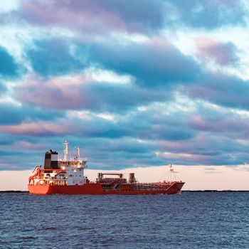 Red cargo oil tanker moving to Baltic sea