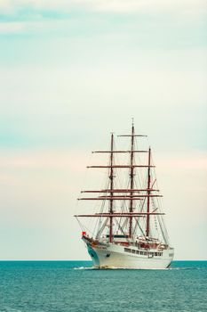 Big white sailing ship with three mast moving to the Riga port