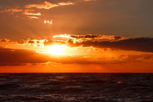 Hot and romantic sunset over the Baltic sea. Calm landscape