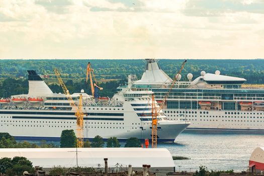 Two cruise liners in Riga. Tour travel and spa services
