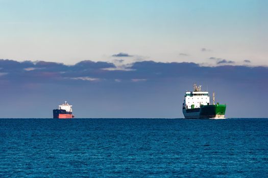 Cargo ships far in still water of Baltic sea