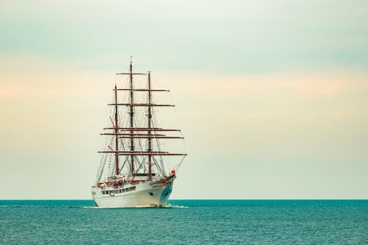 Big white sailing ship with three mast moving to the Riga port