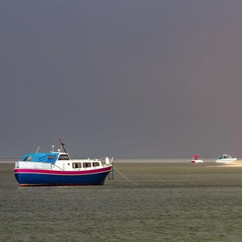 Small blue passenger ship moored at Baltic sea bay