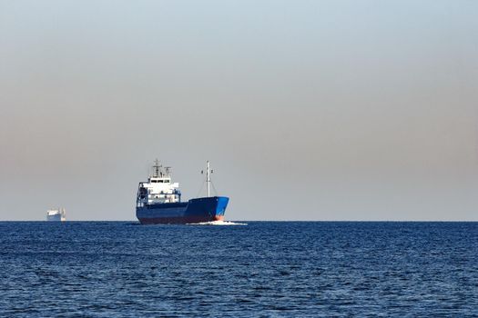 Blue cargo ship sailing from the Baltic sea