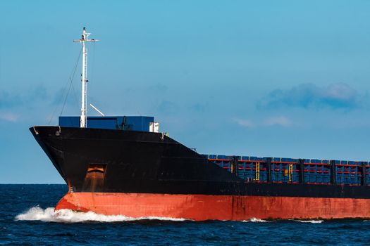 Black bulker ship. Logistics and merchandise transportations