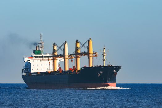 Black cargo ship sailing from the Baltic sea