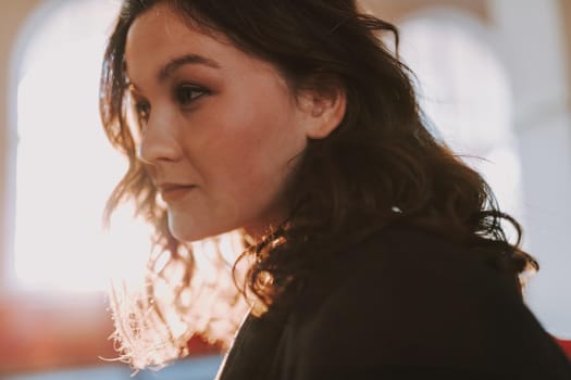 Close up of smiling beautiful woman posing inside the building