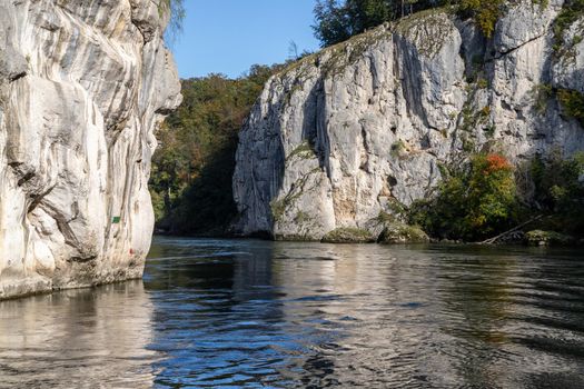 Danube river breakthrough near Kelheim, Bavaria, Germany in autumn with limestone rock formations and clear water on a sunny day at autumn month october