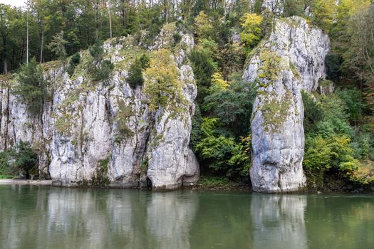 Nature reserve at Danube river breakthrough near Kelheim, Bavaria, Germany in autumn with limestone rock formations and plants with colorful leaves, autumnal impressions