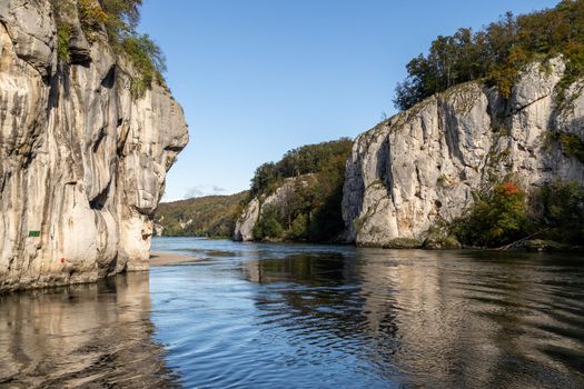 Danube river breakthrough near Kelheim, Bavaria, Germany in autumn with limestone rock formations and clear water on a sunny day at autumn month october