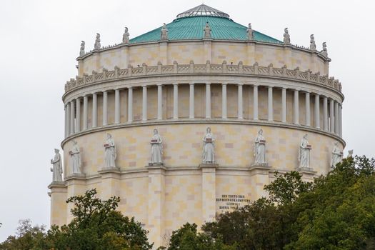 Close up of the Befreiungshalle in Kelheim, Bavaria, Germany at Danube river surrounded with autumnal trees