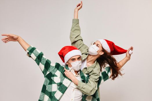 Family holiday Christmas and fun medical mask New Year's hat. High quality photo