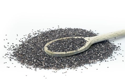 Chia on white background. Chia seeds in wooden spoon isolated with white background.