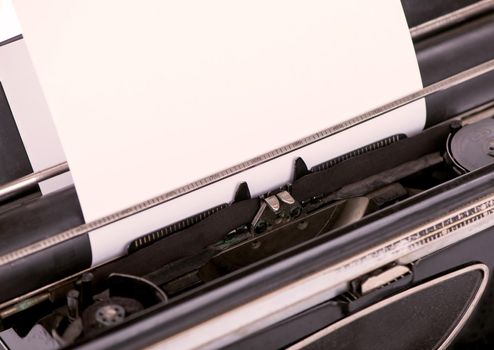 close up image of typewriter with paper sheet. copy space for your text