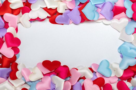 Valentine's day many color silk hearts border frame background , copy space for text, love concept