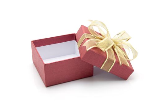 Red gift box and ribbon open isolated on white background, presents in valentine day or Christmas day, object in birthday or anniversary, package with wrap luxury, nobody, holiday and festive concept.
