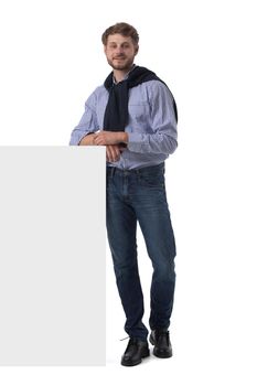 Full length portrait of happy smiling casual man holds blank board isolated on white background