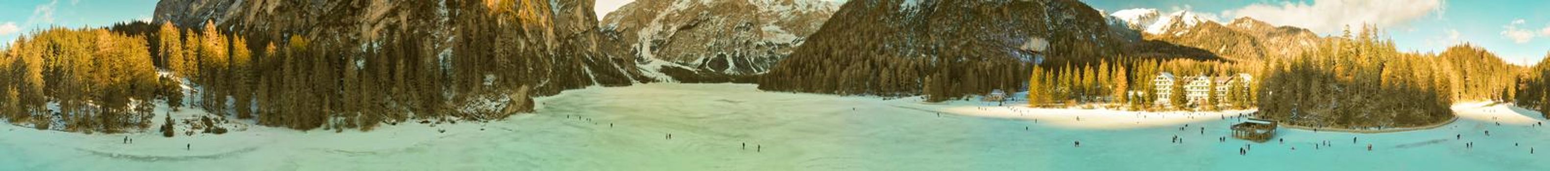Braies Lake blotted in winter, aerial view from drone, Italian Alps.