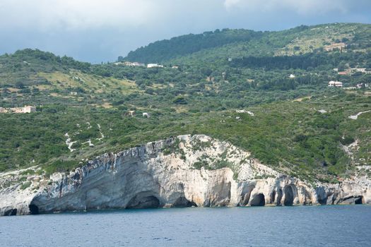 Landscape. Cave with a coastal cliff shoreline. Stock image
