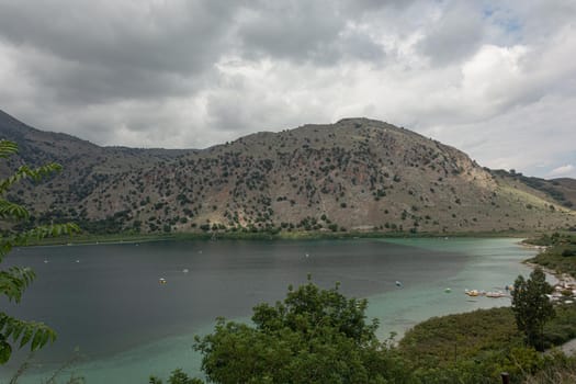 Lake Kournas in a mountainous area. Cloudy weather (Greece, Crete). Stock photo