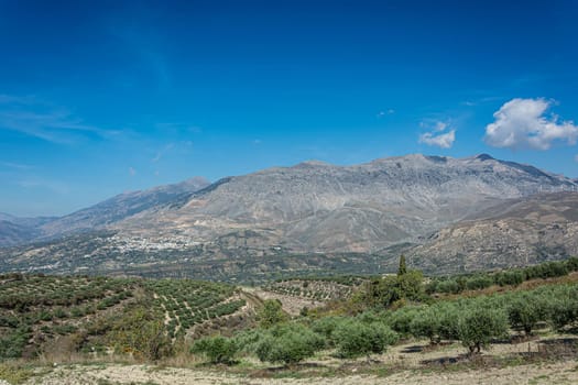 Mountain landscape. Valley in the foothills and mountain range. Stock photo