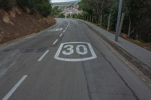 Speed limit on a mountain road. Stock photo