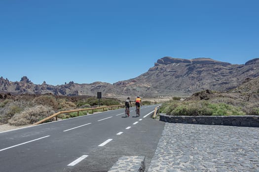 Spain, Tenerife - 05/10/2018: Mountain landscape. Training cyclists on a mountain road. Stock photo