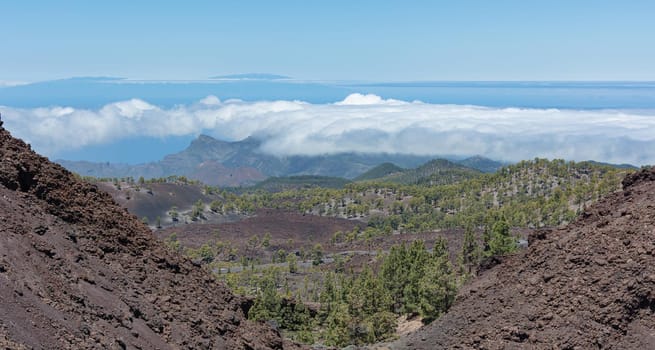 Mountain landscape. View of the clouds from the top of the mountain. Stock photo