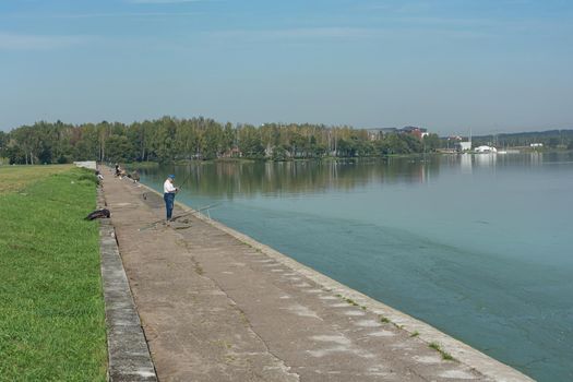 Minsk, Belarus - 09/12/2019: Fish on the river embankment fishing. Stock photo