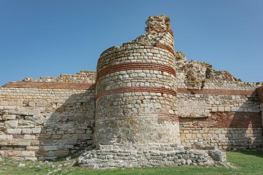Ruins of the walls and towers of the old fortress. Stock photo.