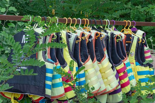 Sozopol, Bulgaria - 09/06/2018: Life jackets hang on a hanger. Stock photo.