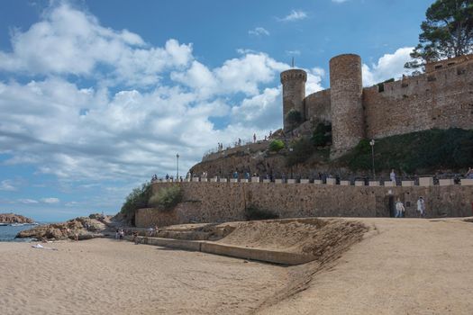 Tossa, Spain - 09/19/2017: old fortress on the sandy beach. Stock photo