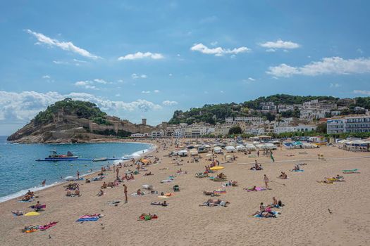 Tossa, Spain - 09/19/2017: city beach and old fortress. Stock photo.