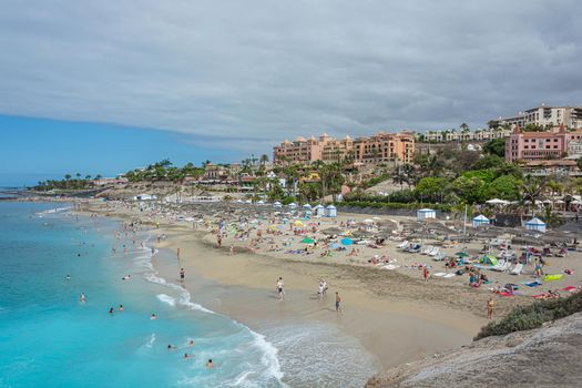 Ocean sand Beach Del Duque (Tenerife, Spain). Stock photo.
