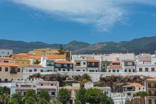 Architecture. Houses on a mountain background.. Stock photo