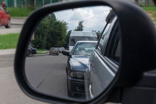 Reflection in the car rearview mirror. Stock photo
