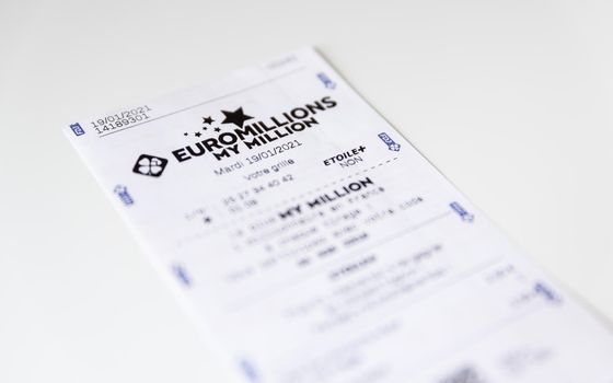 BAYONNE, FRANCE - CIRCA JANUARY 2021: Francaise des Jeux Euromillions receipt on white background. EuroMillions is a European transnational lottery, it was launched in 2004.