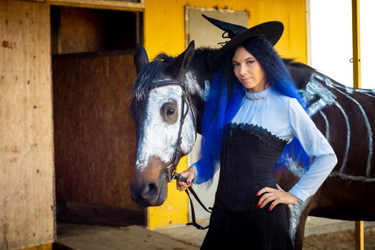 Portrait of a witch with a horse on which a skeleton is painted in white paint