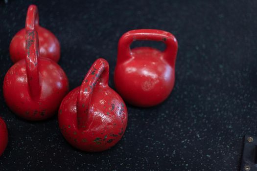 Red old Kettlebell standing black floor with copy space Fitness concept background