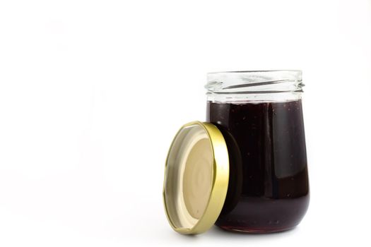 Grape jam isolated on white background.