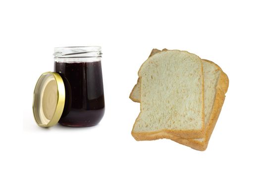 Whole wheat bread stack with grape jam on isolated white background.