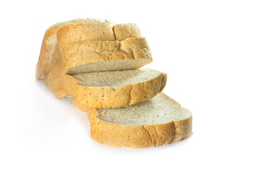 Whole wheat bread stack on isolated white background.