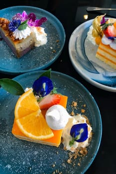 Orange cake with orange topping on plate ready to eat