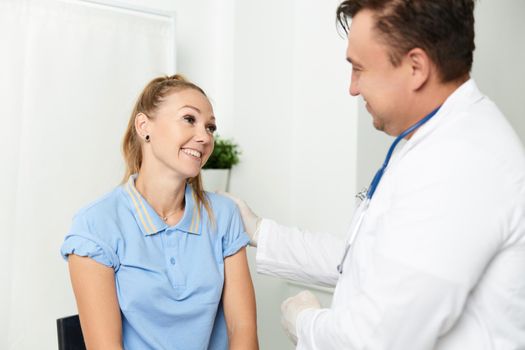 cheerful patient next to the doctor treatment lifestyle hospital. High quality photo